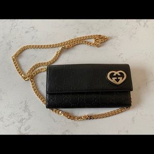 Gucci GG Supreme leather wallet on chain